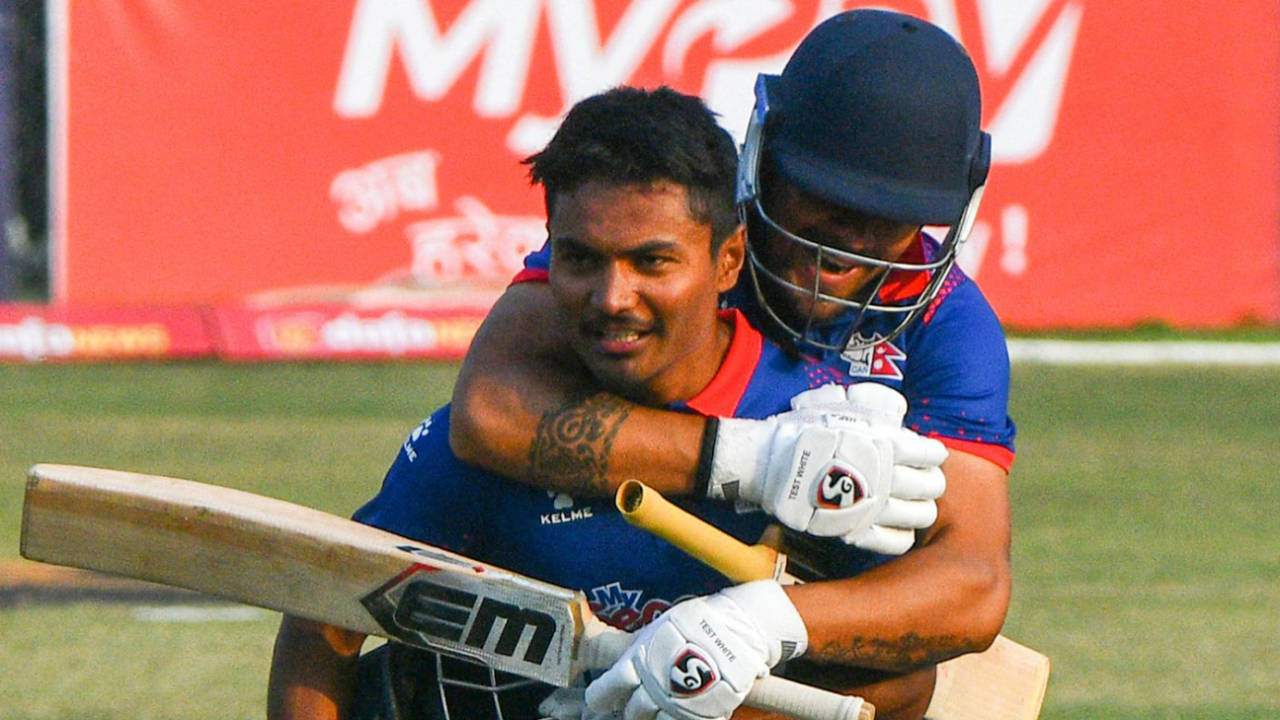 Karan KC leaps onto captain Rohit Paudel's back after they sealed the win, Nepal vs Scotland, ICC Men's Cricket World Cup League 2, Kirtipur, February 21, 2023
