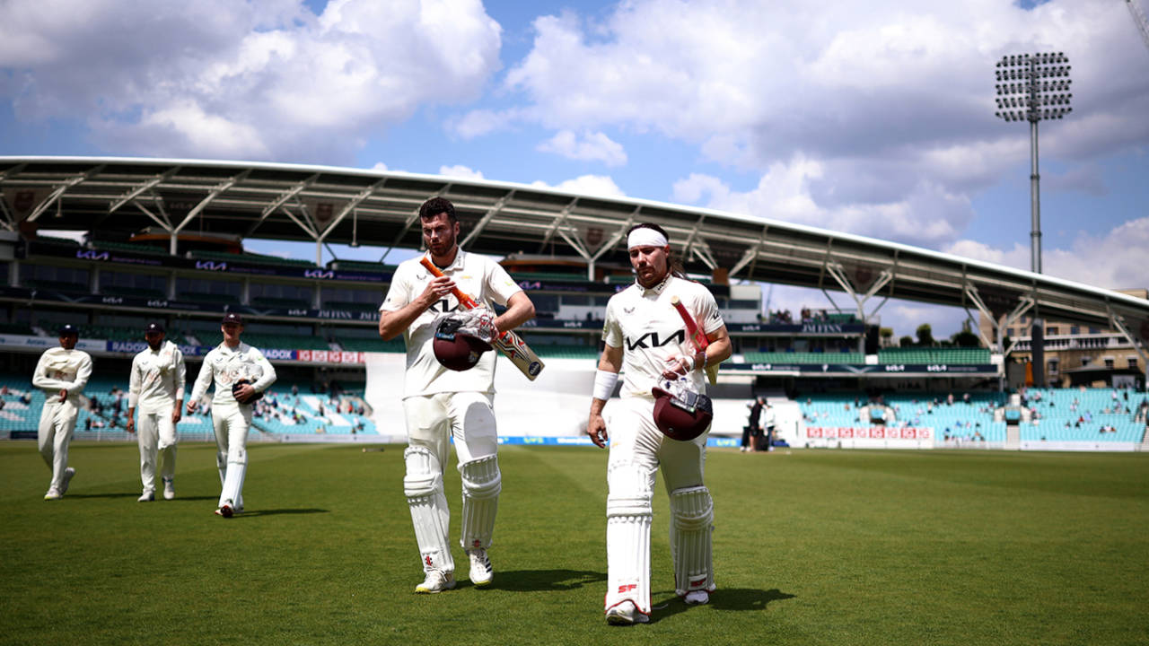 Dom Sibley and Rory Burns walk off after sealing victory for Surrey&nbsp;&nbsp;&bull;&nbsp;&nbsp;Getty Images for Surrey CCC
