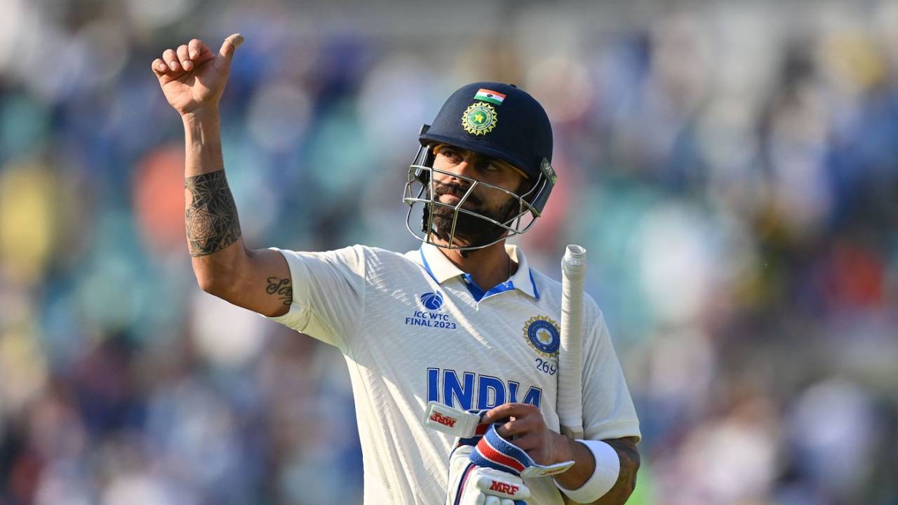 Virat Kohli gives a thumbs up to the crowd at the end of day's play • AFP/Getty Images