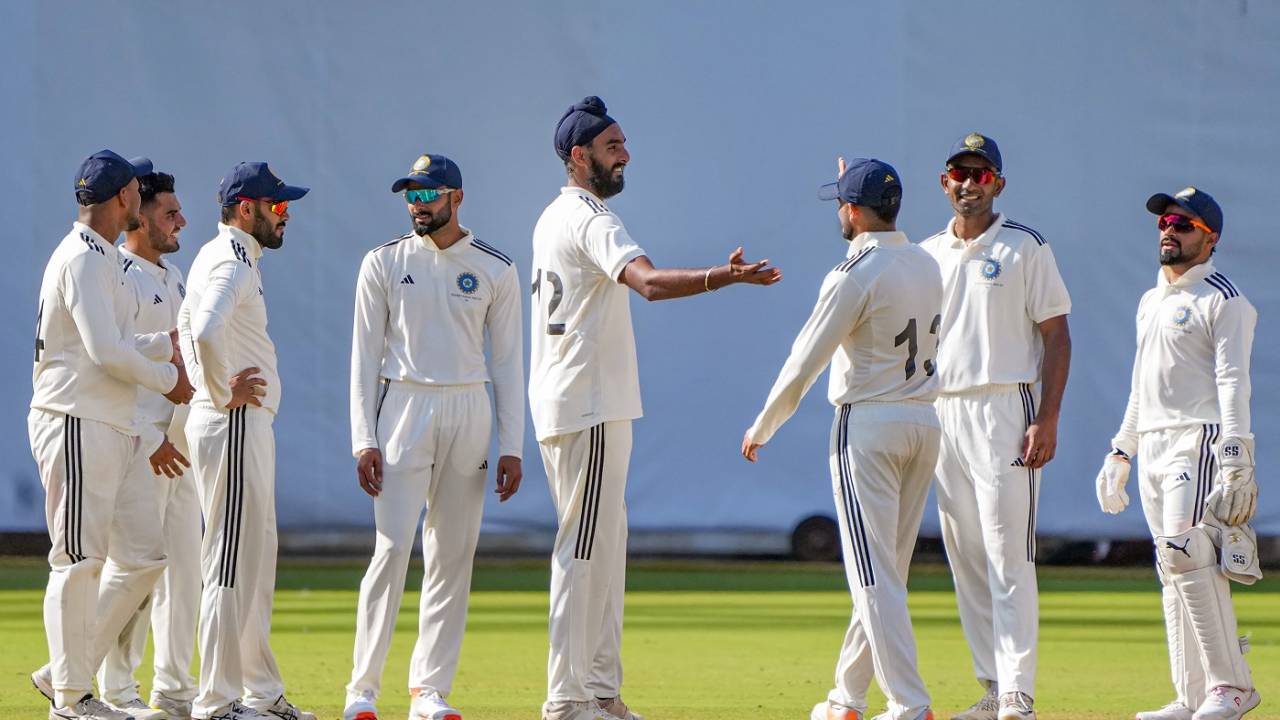 Team-mates surround Baltej Singh after he got a wicket, North Zone vs North East Zone, Duleep Trophy, 3rd day, Bengaluru, June 30, 2023