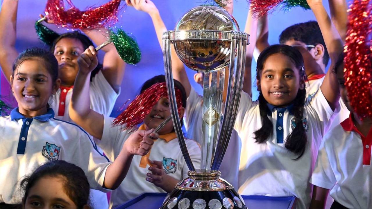 Young girls with the World Cup trophy in Mumbai, July 4, 2023