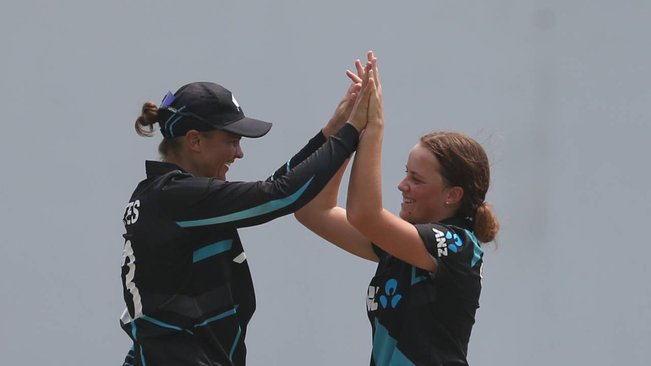 Eden Carson celebrates one of her wickets with Suzie Bates