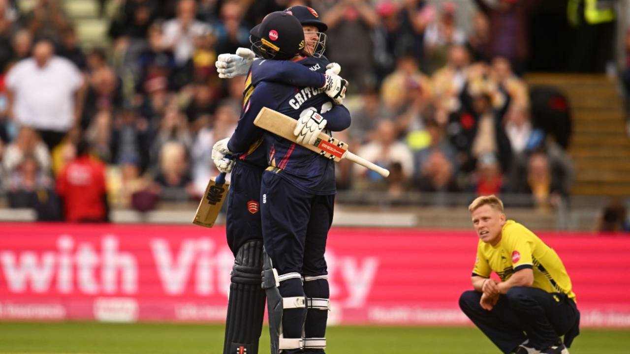 Matt Critchley and Simon Harmer embrace as Hampshire's Nathan Ellis sinks to his haunches&nbsp;&nbsp;&bull;&nbsp;&nbsp;Getty Images