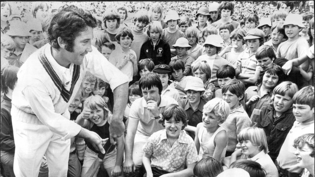 Brian Taber demonstrates a cricket stroke to young cricket fans, Drummoyne Oval, Sydney, October 7, 1973