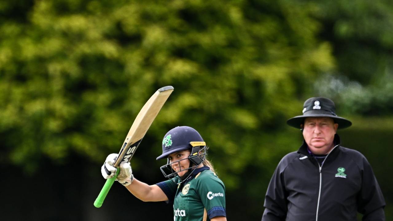 Amy Hunter raises her bat after reaching her second ODI fifty, Ireland vs Australia, 2nd women's ODI, Dublin, July 25, 2023