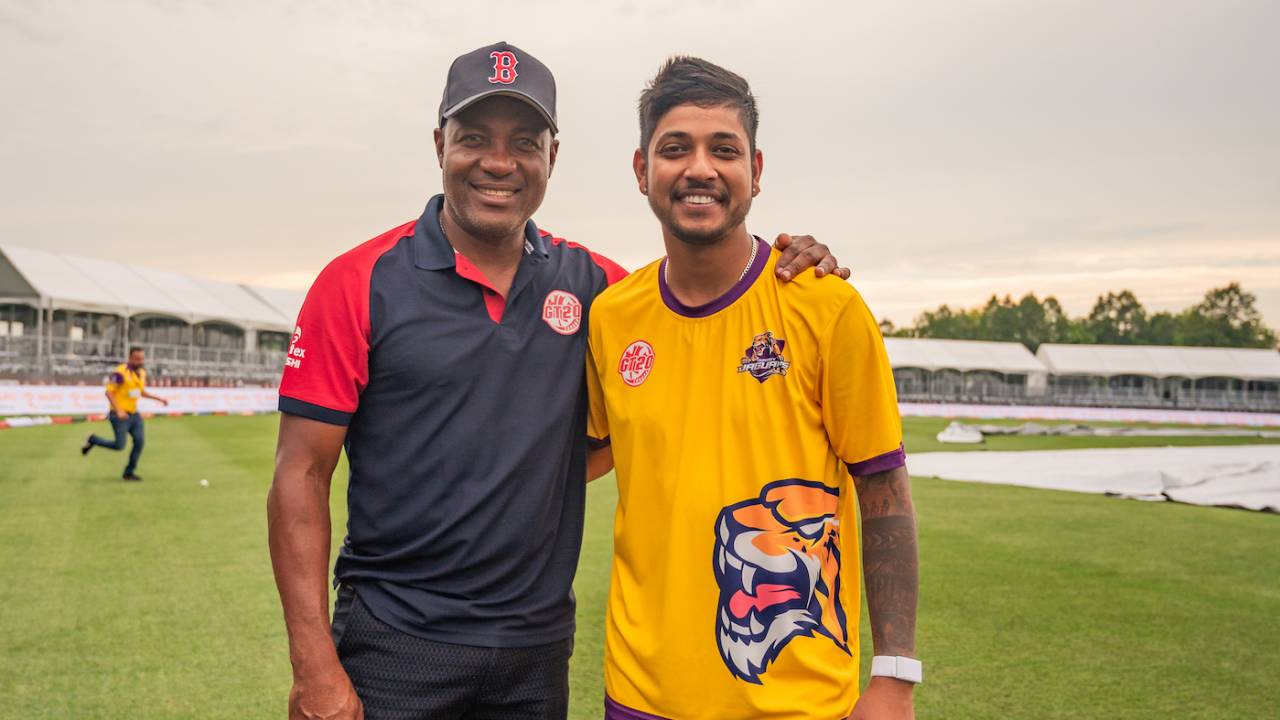 Brian Lara and Sandeep Lamichhane pose for a picture