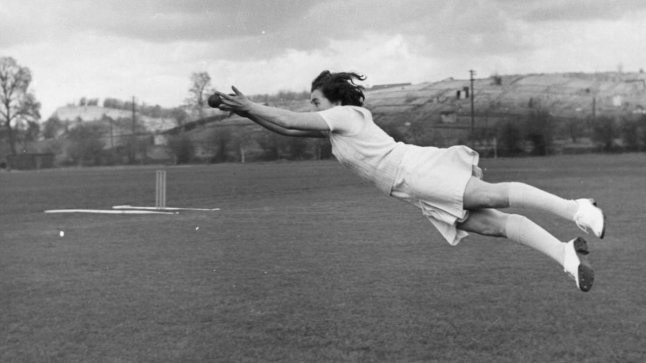 Yorkshire and England women's fast bowler Mary Johnson leaps at full stretch for a catch, May 5, 1951