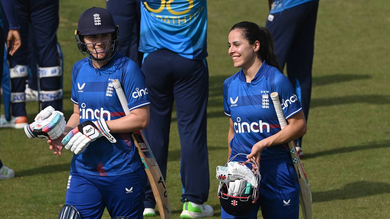Nat Sciver-Brunt and Maia Bouchier walk off after completing victory