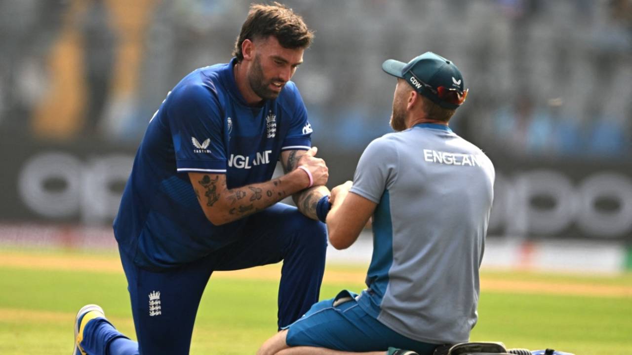 Reece Topley received the physio's attention on his injured finger before walking off, England vs South Africa, Men's World Cup 2023, Mumbai, October 21, 2023