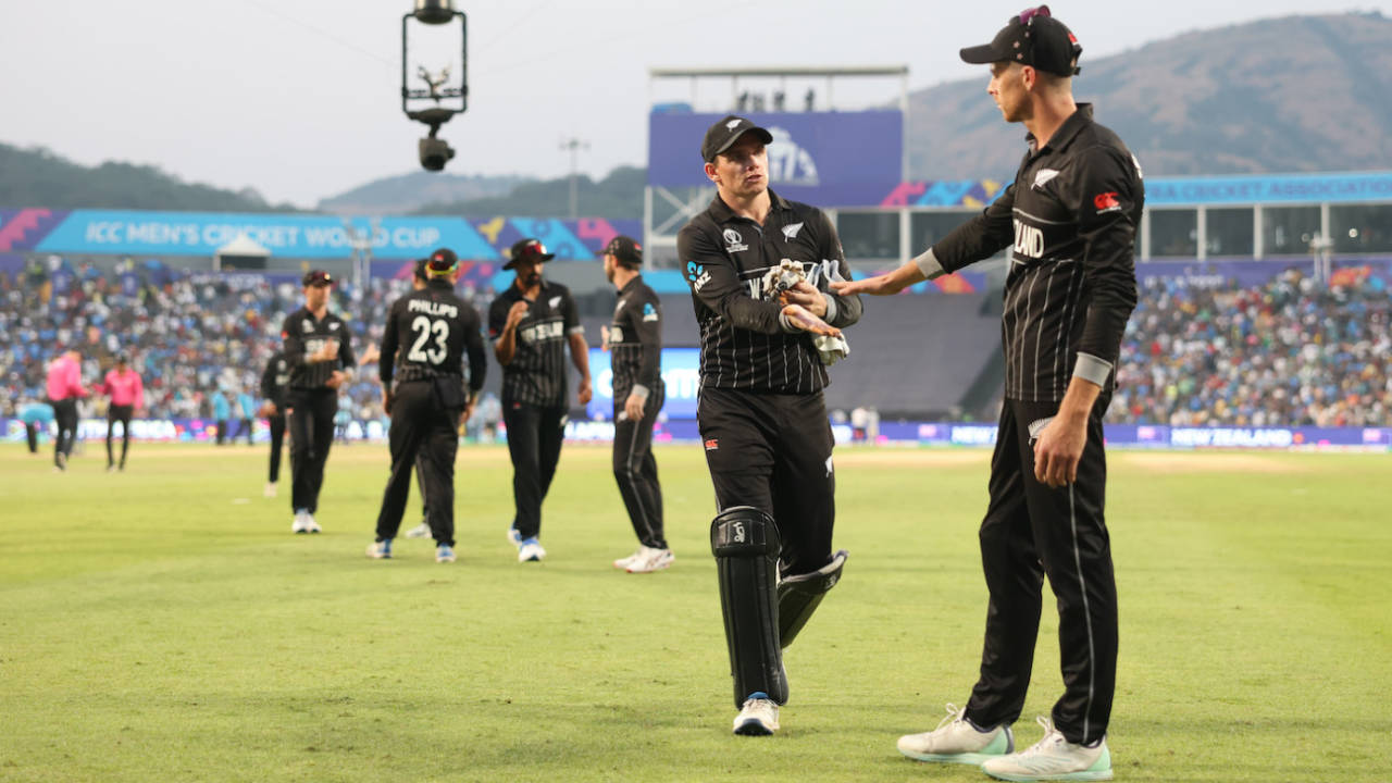 Tom Latham and Mitchell Santner have a chat at the end of the innings, New Zealand vs South Africa, ICC Men's World Cup 2023, Pune, November 1, 2023
