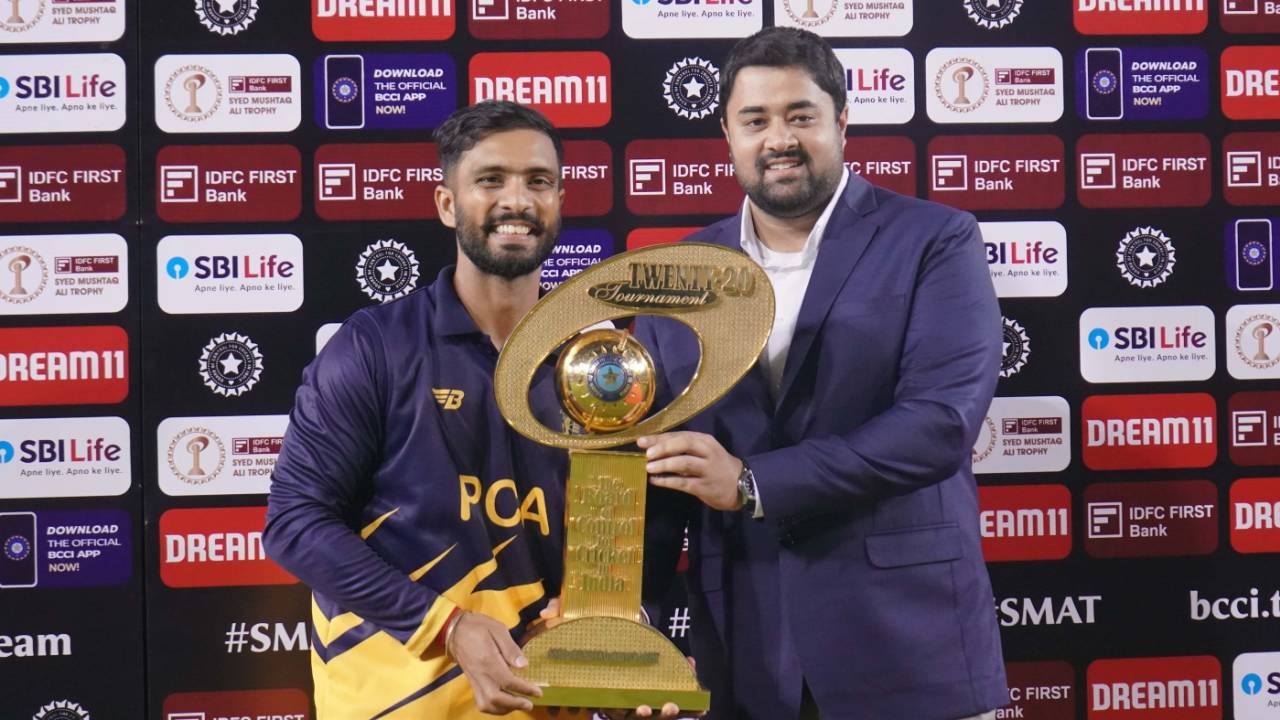 Mandeep Singh collects the trophy from PCA secretary Dilsher Khanna