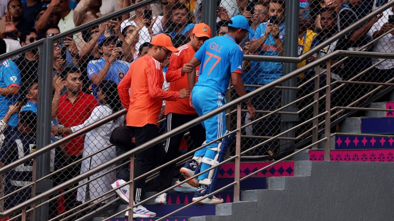 Shubman Gill needs help to go up the stairs after cramping during his innings&nbsp;&nbsp;&bull;&nbsp;&nbsp;ICC/Getty Images