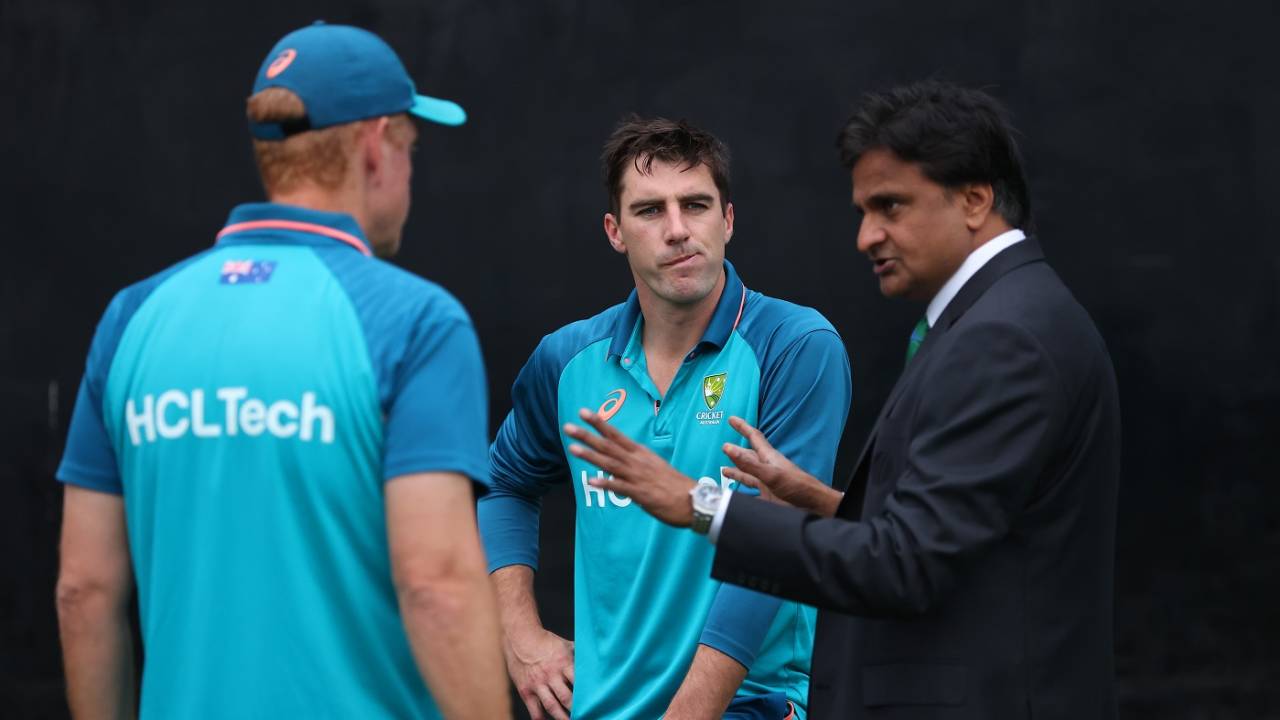Pat Cummins and Andrew McDonald have a word with match referee Javagal Srinath