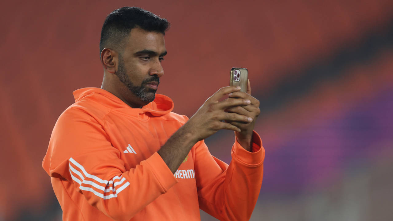 R Ashwin uses his mobile phone on the eve of the World Cup final, Ahmedabad, November 18, 2023