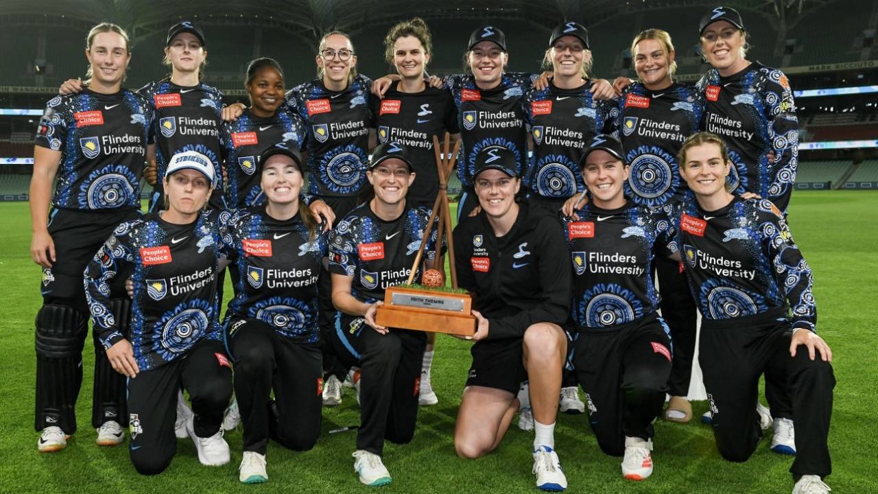 The Adelaide Strikers team with the Faith Thomas Trophy after beating Perth Scorchers&nbsp;&nbsp;&bull;&nbsp;&nbsp;Getty Images