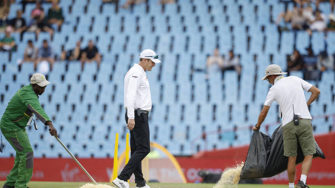 Groundsmen use sawdust on the field as Stephen Harris looks on, South Africa vs India, 1st Test, Centurion, 1st day, December 26, 2023
