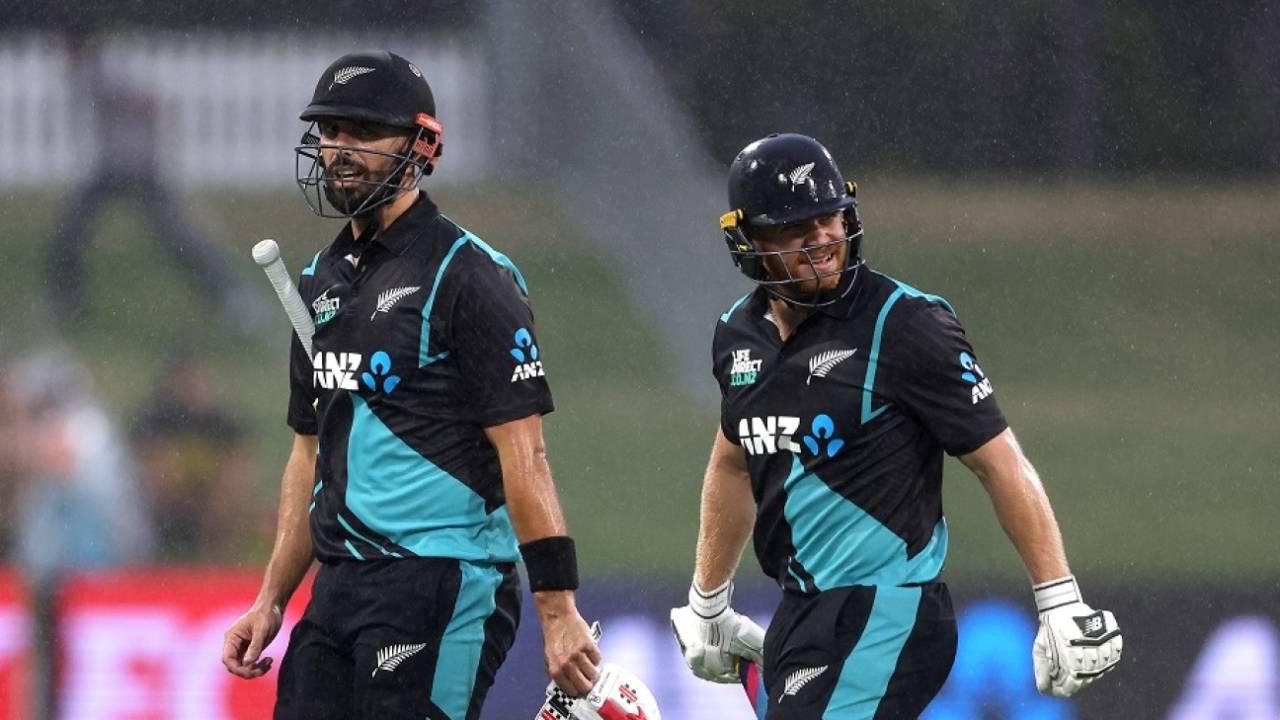 Daryl Mitchell and Glenn Phillips walk off as rain makes its way to the middle, New Zealand vs Bangladesh, 2nd T20I, Mount Maunganui, December 29, 2023