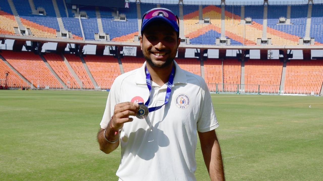 Siddharth Desai shows off his Player-of-the-Match medal, Gujarat vs Karnataka, Ranji Trophy, 4th day, Ahmedabad, January 15, 2024