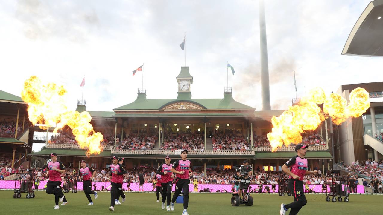 Sydney Sixers make their way out for the final