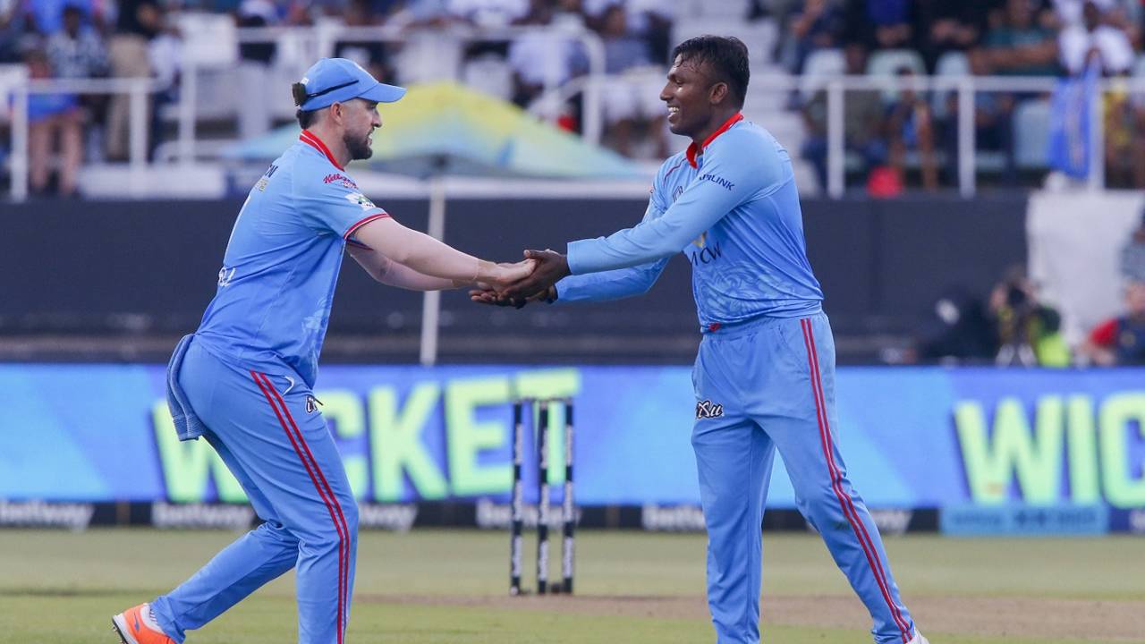 Senuran Muthusamy celebrates a wicket with his captain Wayne Parnell