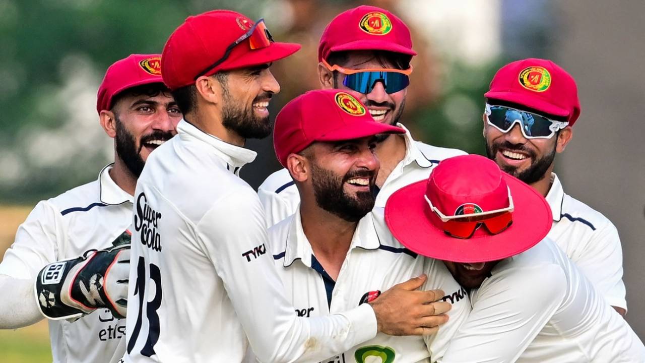 Hashmatullah Shahidi is mobbed by team-mates after his direct hit took care of Dhananjaya De Silva, Sri Lanka vs Afghanistan, Only Test, Colombo, 2nd day, February 3, 2024