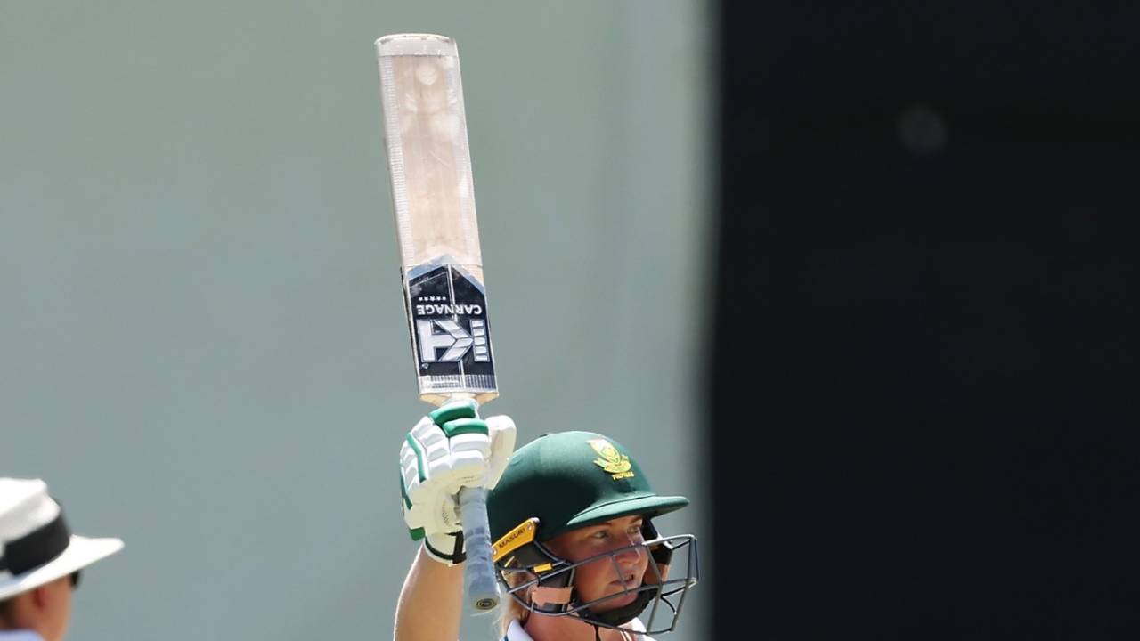 Delmi Tucker raises her bat for her maiden Test half-century