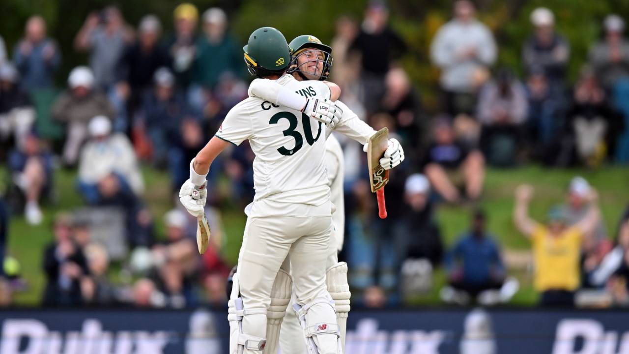 Alex Carey and Pat Cummins embrace after Australia got the winning runs