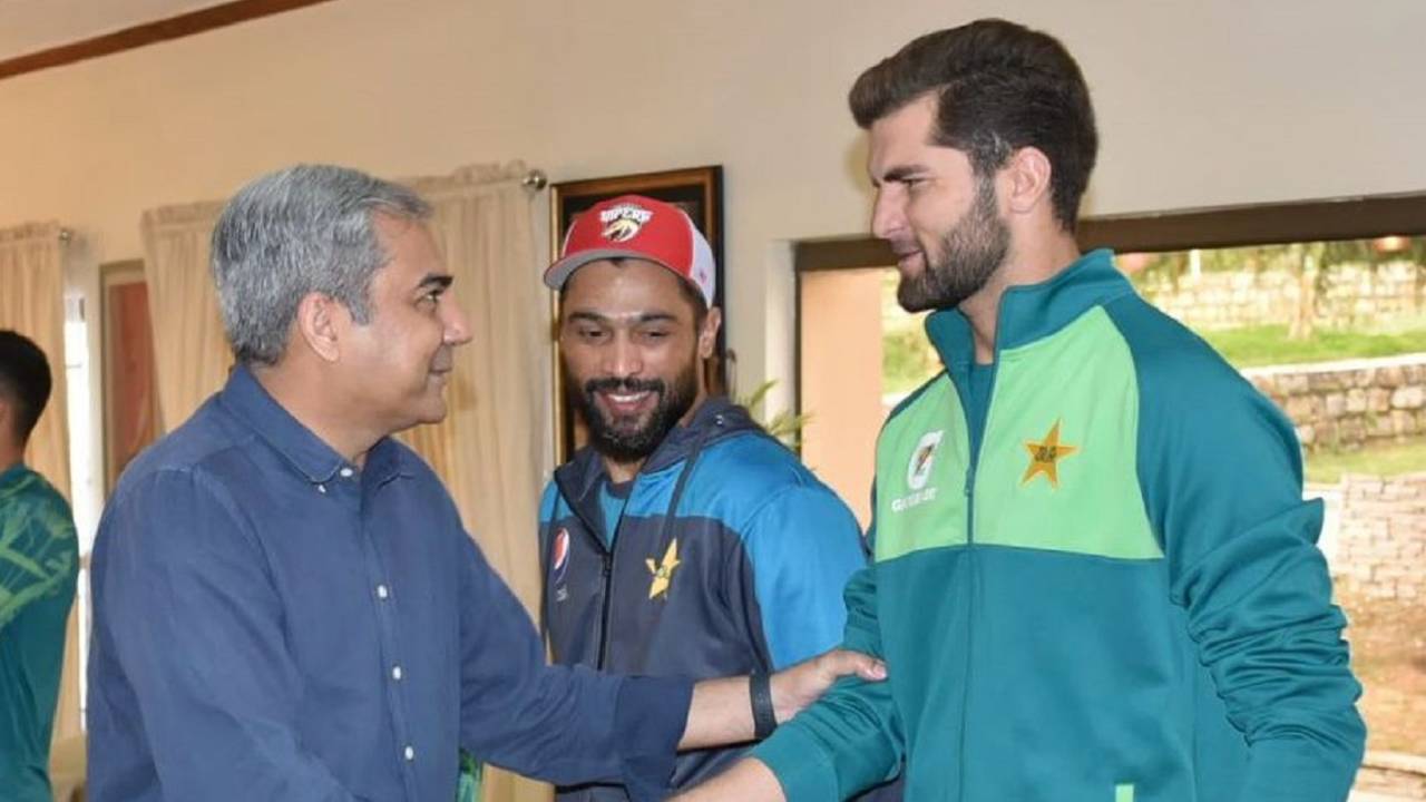 PCB chairman Mohsin Naqvi and Shaheen Shah Afridi shake hands as Mohammad Amir looks on