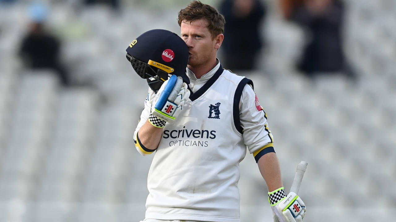 Alex Davies kisses the badge after notching a double-hundred on day one, Warwickshire vs Durham, County Championship, Division One, Edgbaston, April 12, 2024