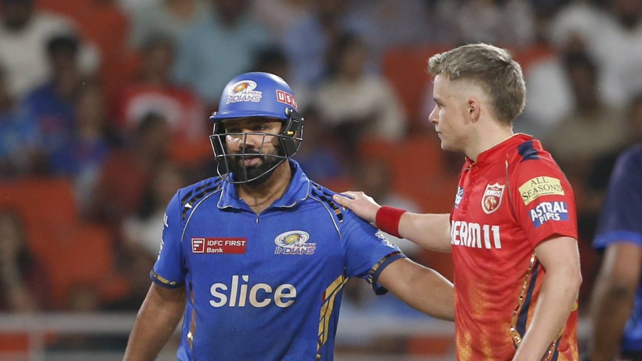 Sam Curran checks in on Rohit Sharma after hitting his helmet (off an attempted sweep)
