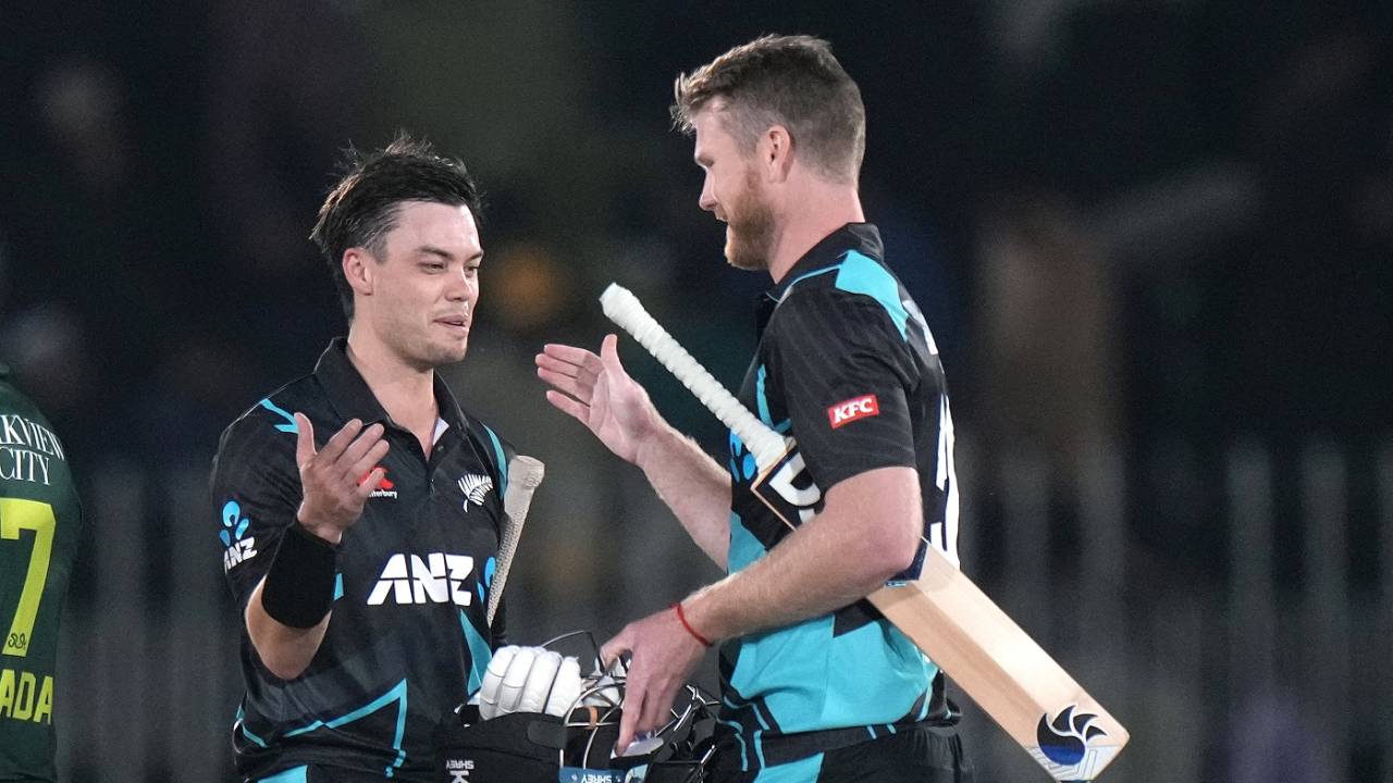 Mark Chapman and James Neesham celebrate after getting the better of Pakistan by seven wickets