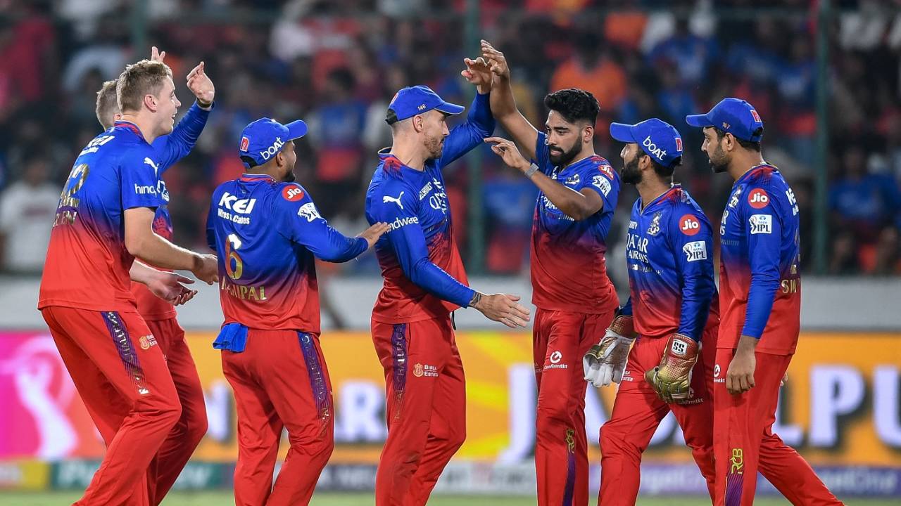 RCB players congratulate Mohammed Siraj, who ran back and took a well-judged catch