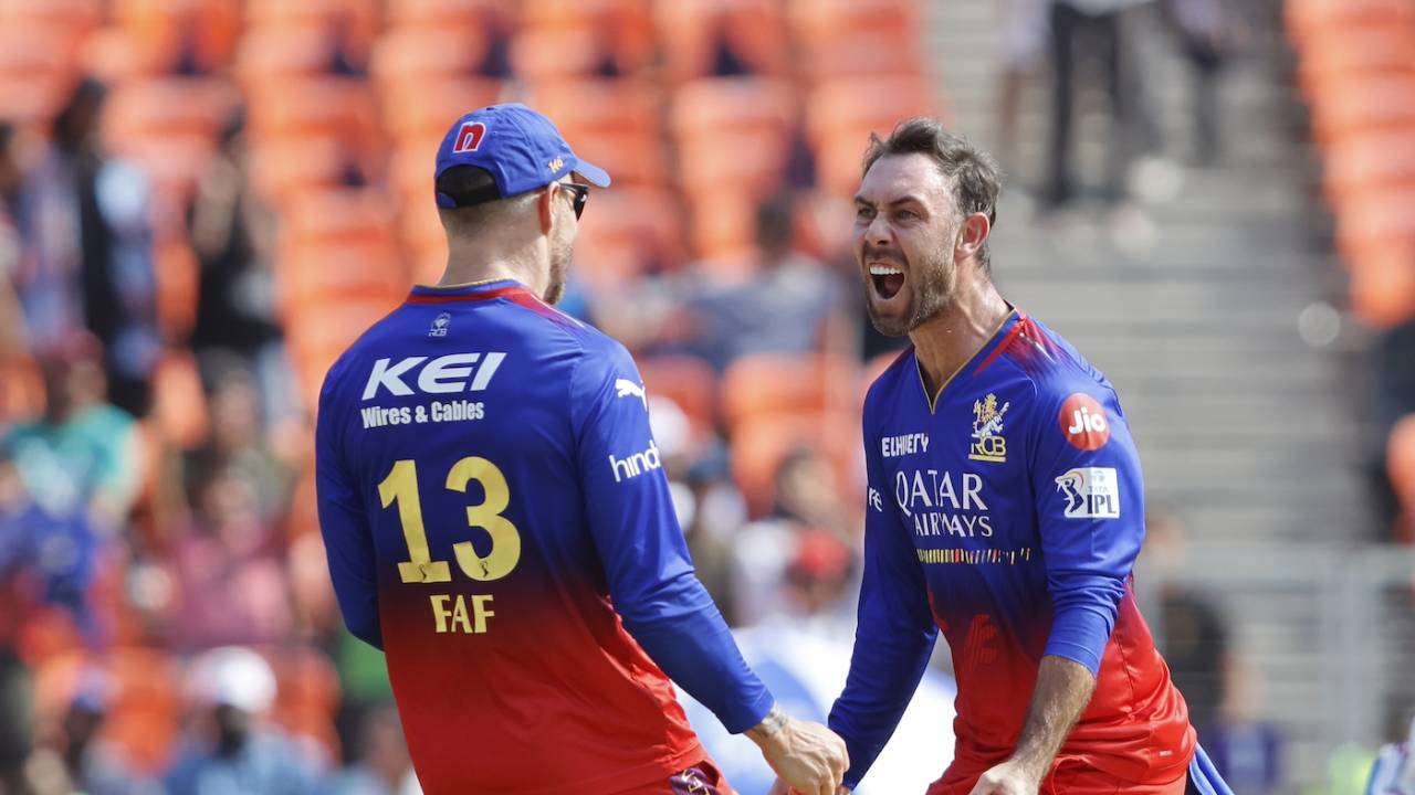 Glenn Maxwell celebrates with Faf du Plessis his first wicket on return