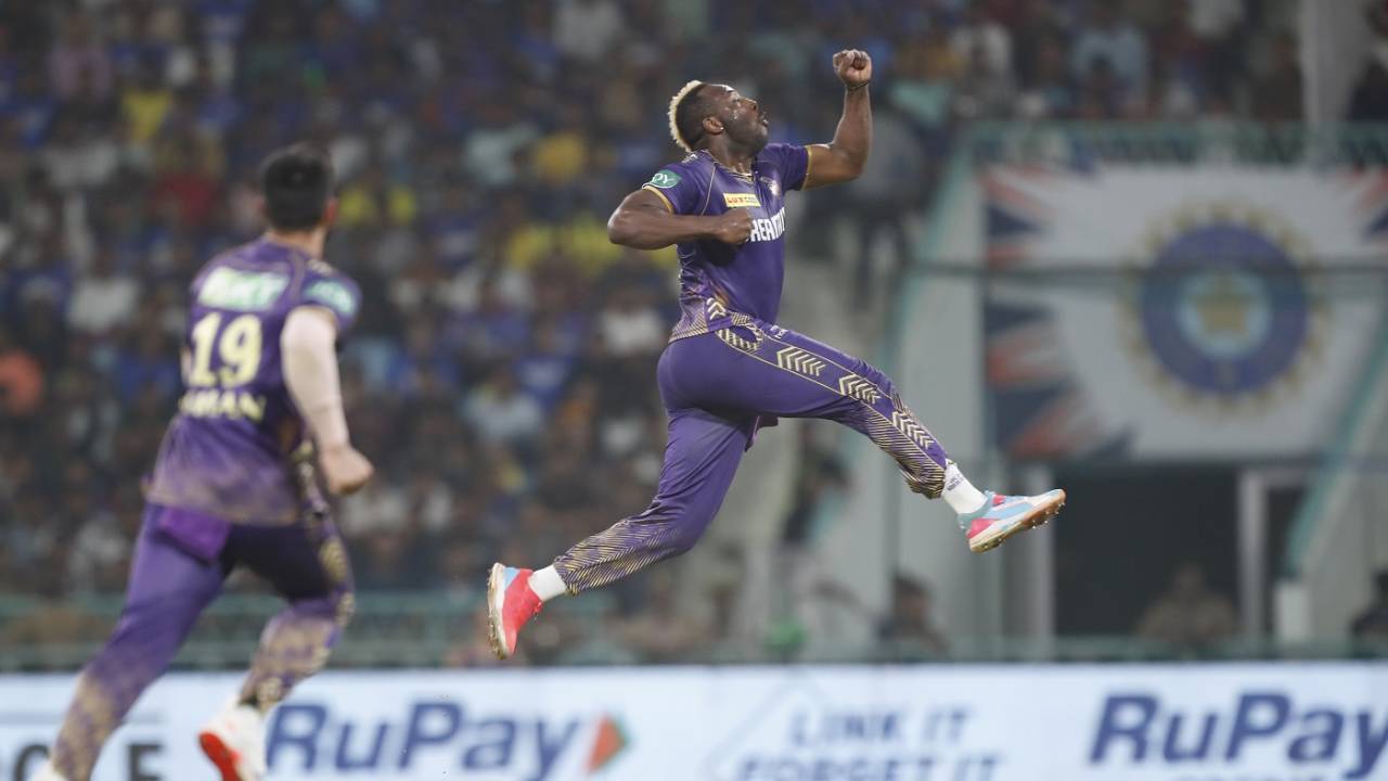 Like a boxer punching the air, Andre Russell celebrates the wicket of Nicholas Pooran
