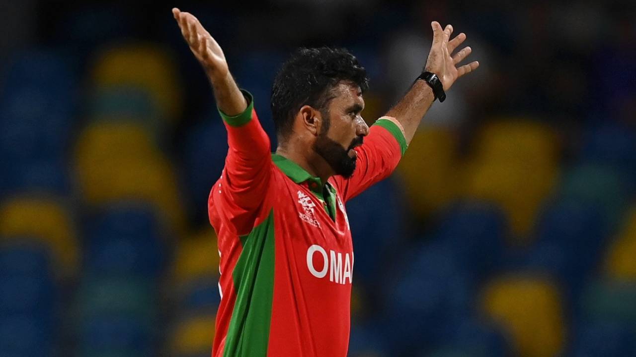 Bilal Khan celebrates the wicket of Travis Head, Australia vs Oman, T20 World Cup, Bridgetown, June 5, 2024