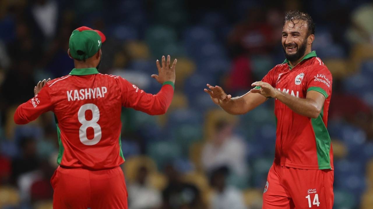 Mehran Khan and Kashyap Prajapati celebrate a wicket, June 5, 2024