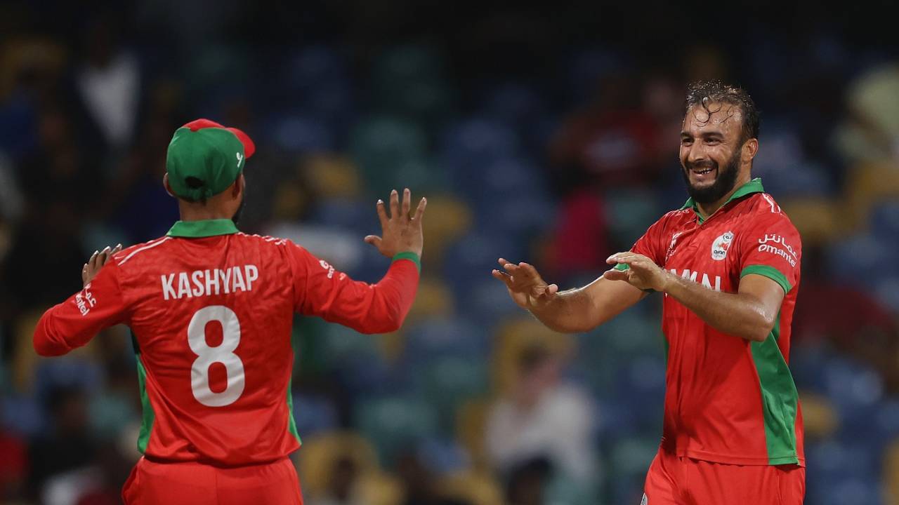Mehran Khan and Kashyap Prajapati celebrate a wicket, June 5, 2024