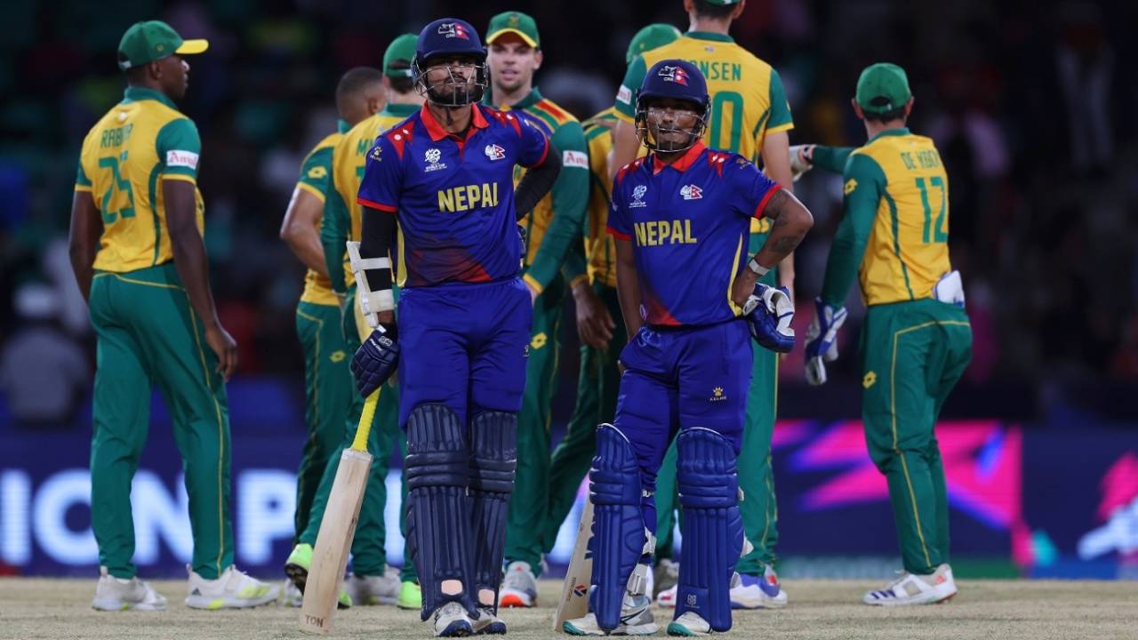 Gulsan Jha and Sompal Kami wait for the the third umpire's run out call on the last ball, Nepal vs South Africa, Men's T20 World Cup, Kingstown, June 14, 2024