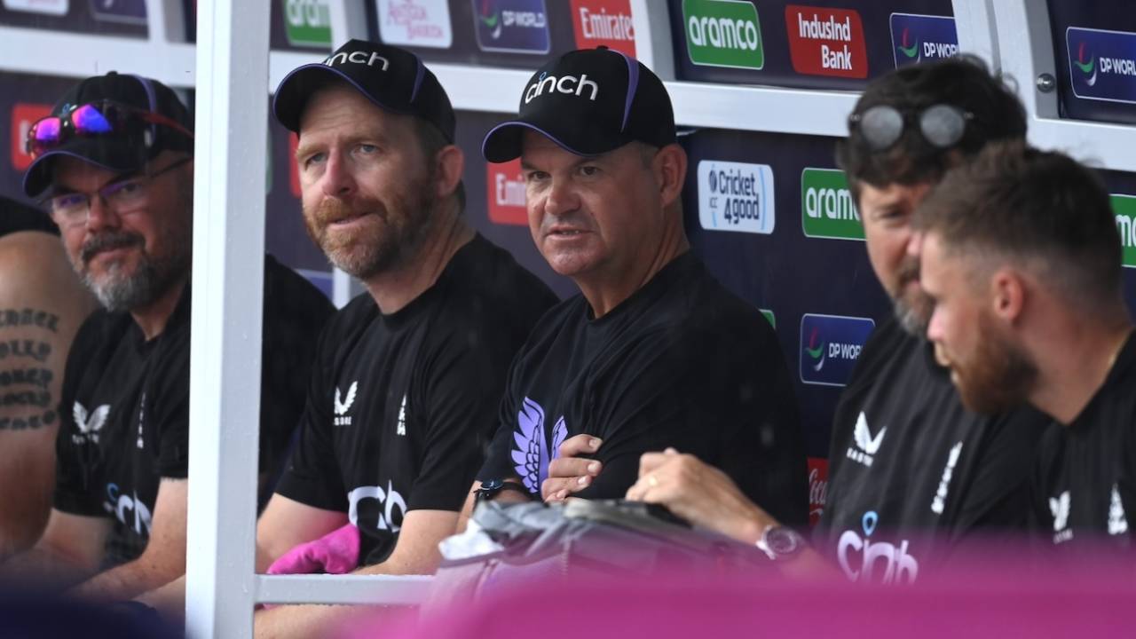 Matthew Mott and other members of England's support staff wait for the rain to stop, England vs Namibia, T20 World Cup 2024, North Sound, June 15, 2024