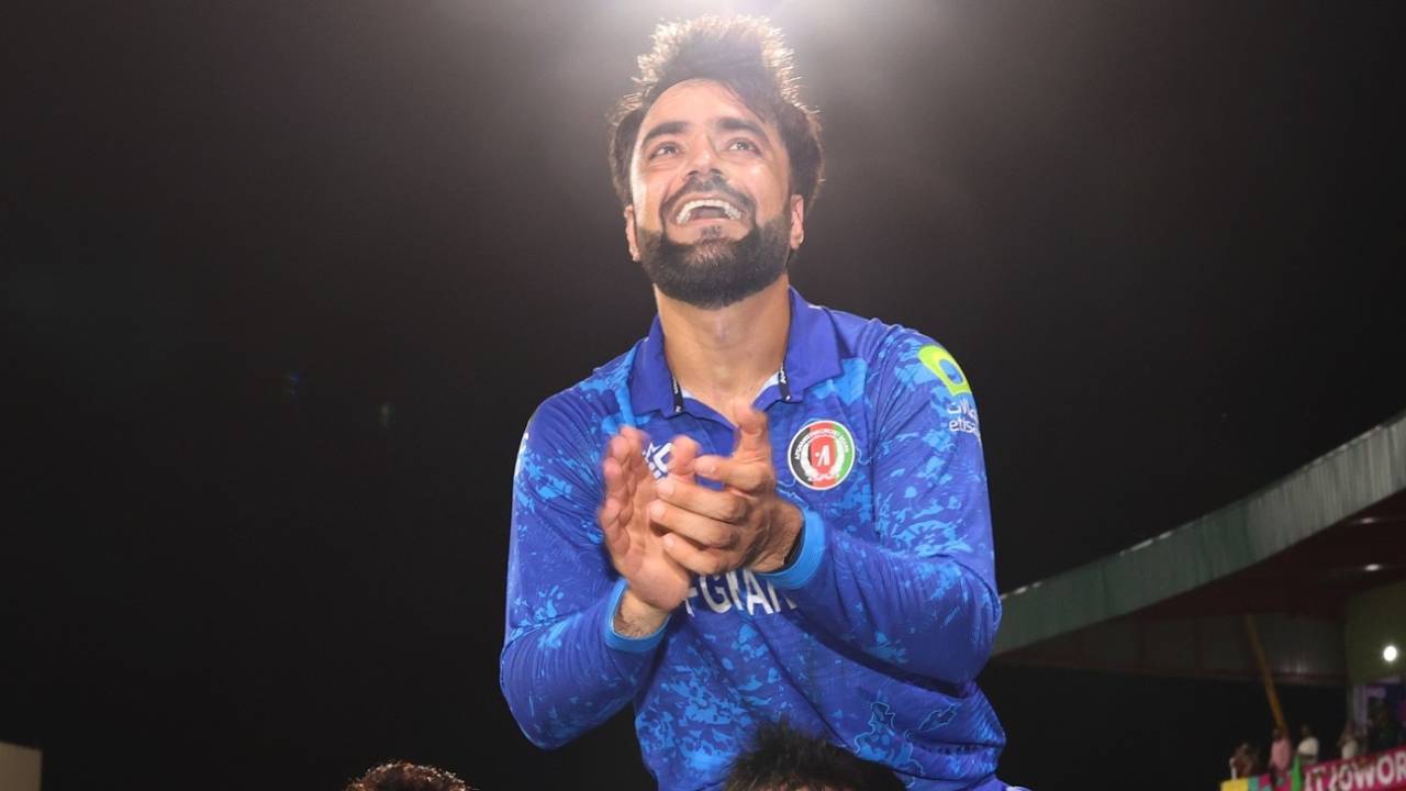 Rashid Khan is carried aloft after the victory by Nangyal Kharote, Afghanistan vs Bangladesh, Super Eight, Group 1, Men's T20 World Cup 2024, Kingstown, June 25, 2024