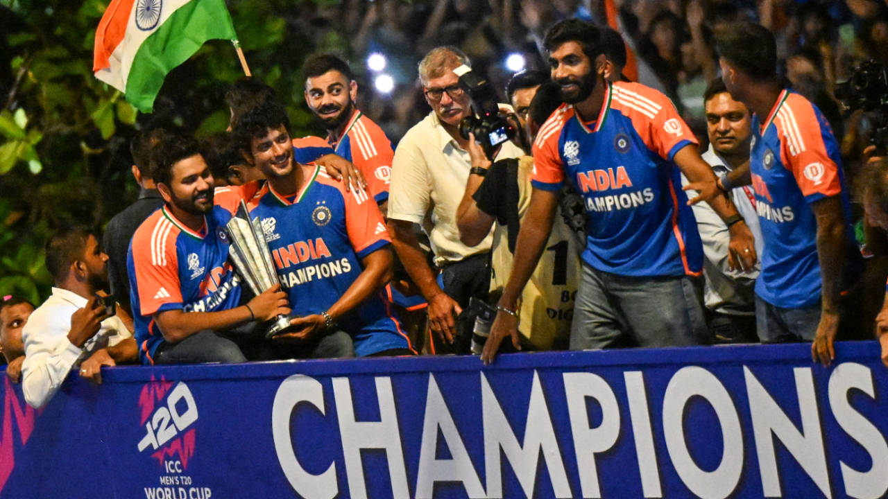 The Indian players show off the T20 World Cup trophy on their open-top bus parade, Mumbai, July 4, 2024
