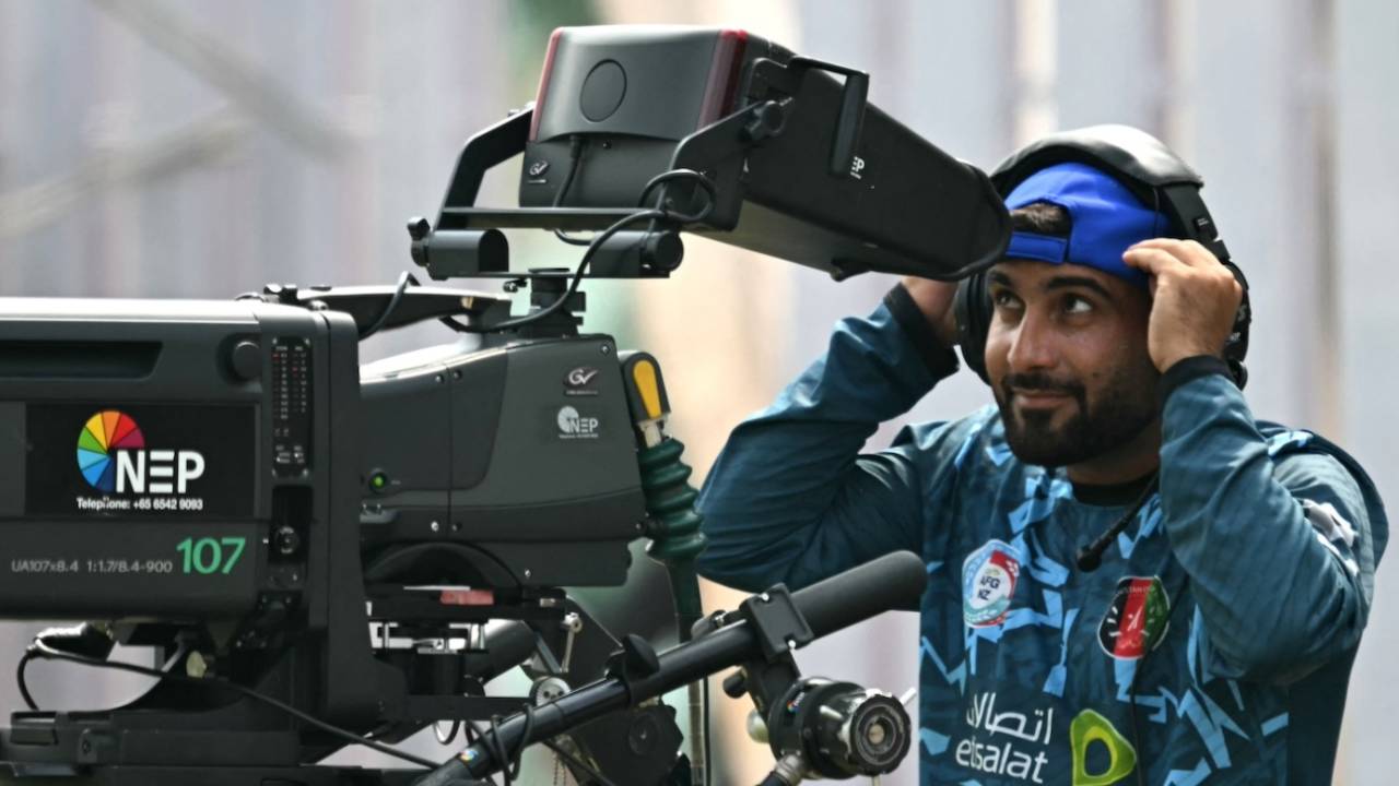 With no play on, Hashmatullah Shahidi amuses himself by getting behind a cameraAfghanistan vs New Zealand, Only Test, Greater Noida, 1st day, September 9, 2024