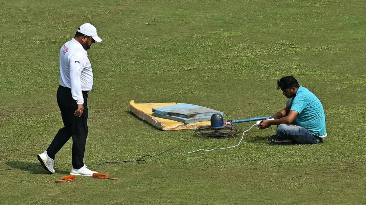 A groundsman uses a fan to dry a patch of wet outfield, Afghanistan vs New Zealand, Only Test, 2nd day, Greater Noida, September 10, 2024
