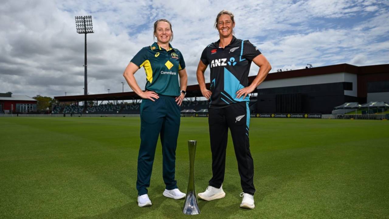 Alyssa Healy and Sophie Devine pose with the trophy in Mackay