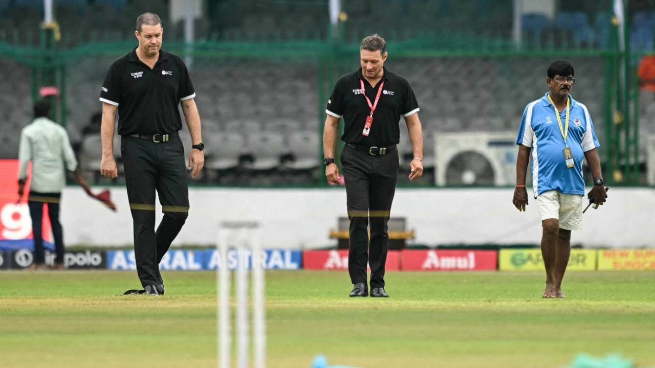 Umpires Chris Brown and Richard Kettleborough examine a few wet spots on the outfield, India vs Bangladesh, 2nd Test, 3rd day, Kanpur, September 29, 2024