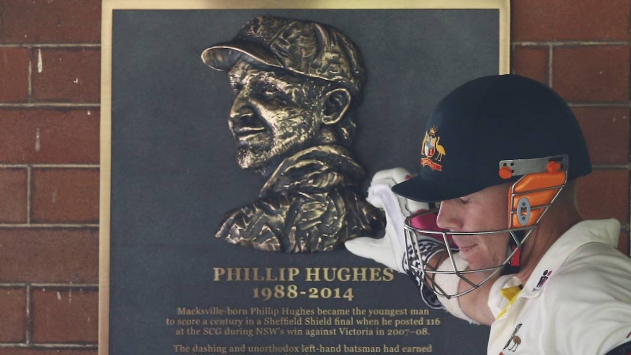 David Warner touches a memorial plaque for Phillip Hughes before going out to bat, Australia v India, 4th Test, Sydney, 1st day, January 6, 2015