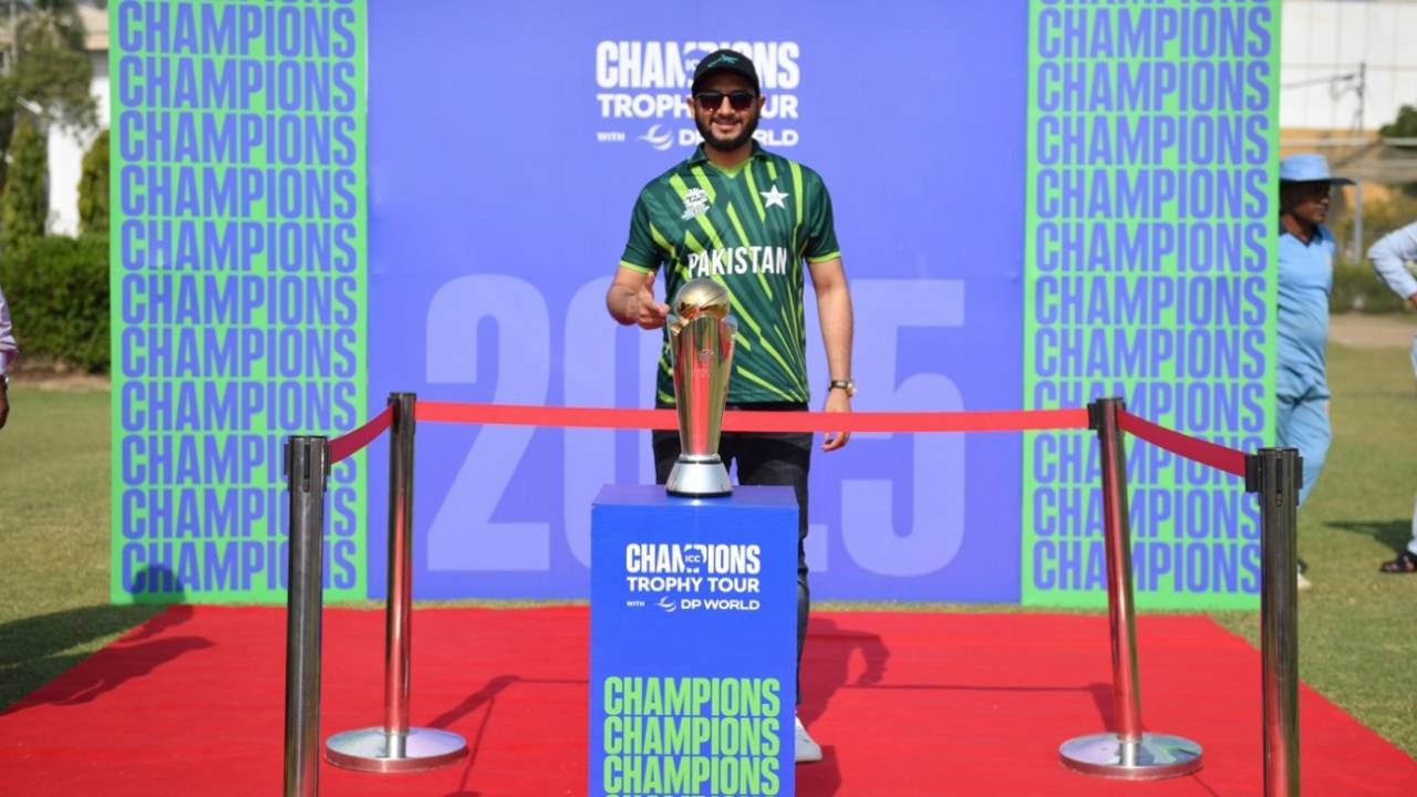 A Pakistan fan poses with the Champions Trophy, Karachi, November 21, 2024