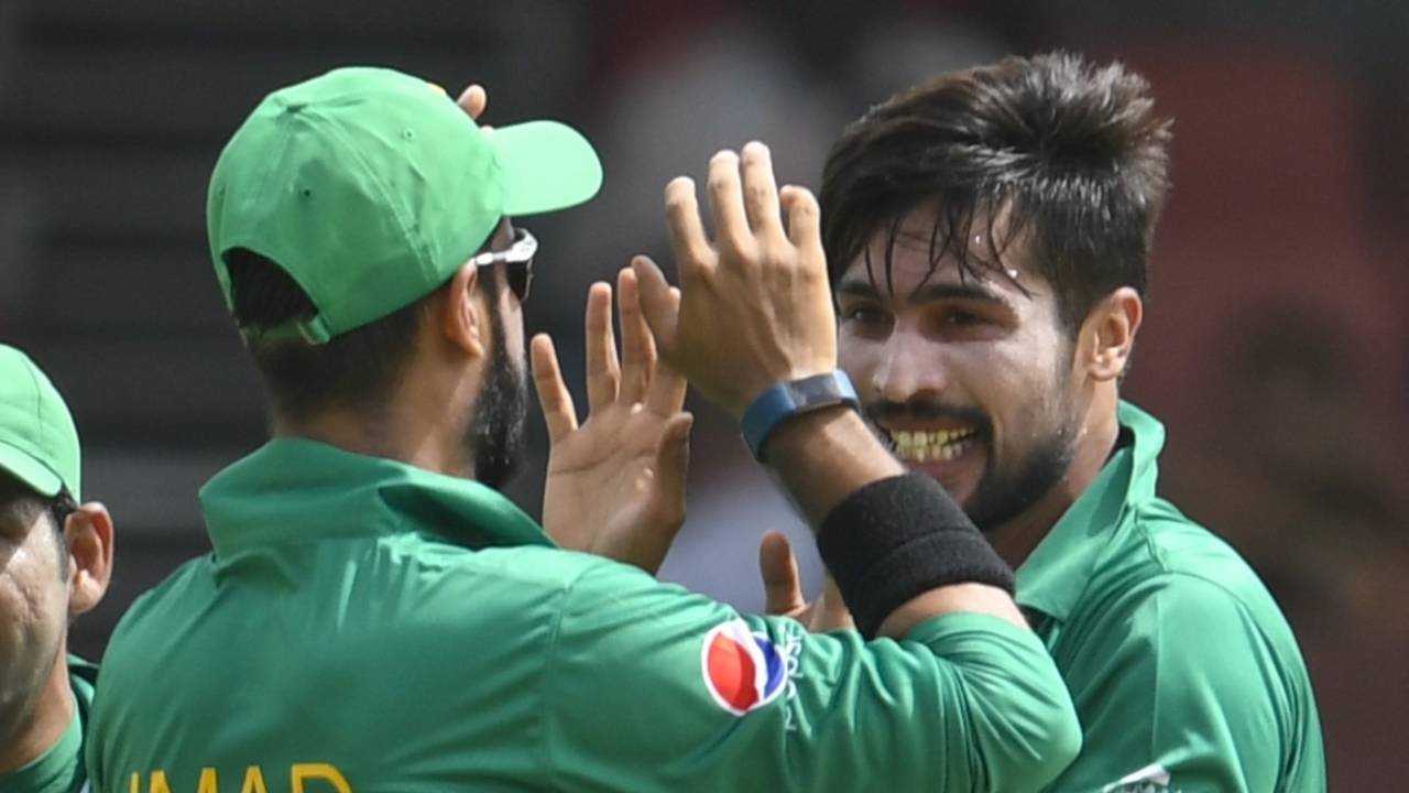 Mohammad Amir and Imad Wasim celebrate a wicket, Providence, April 7, 2017
