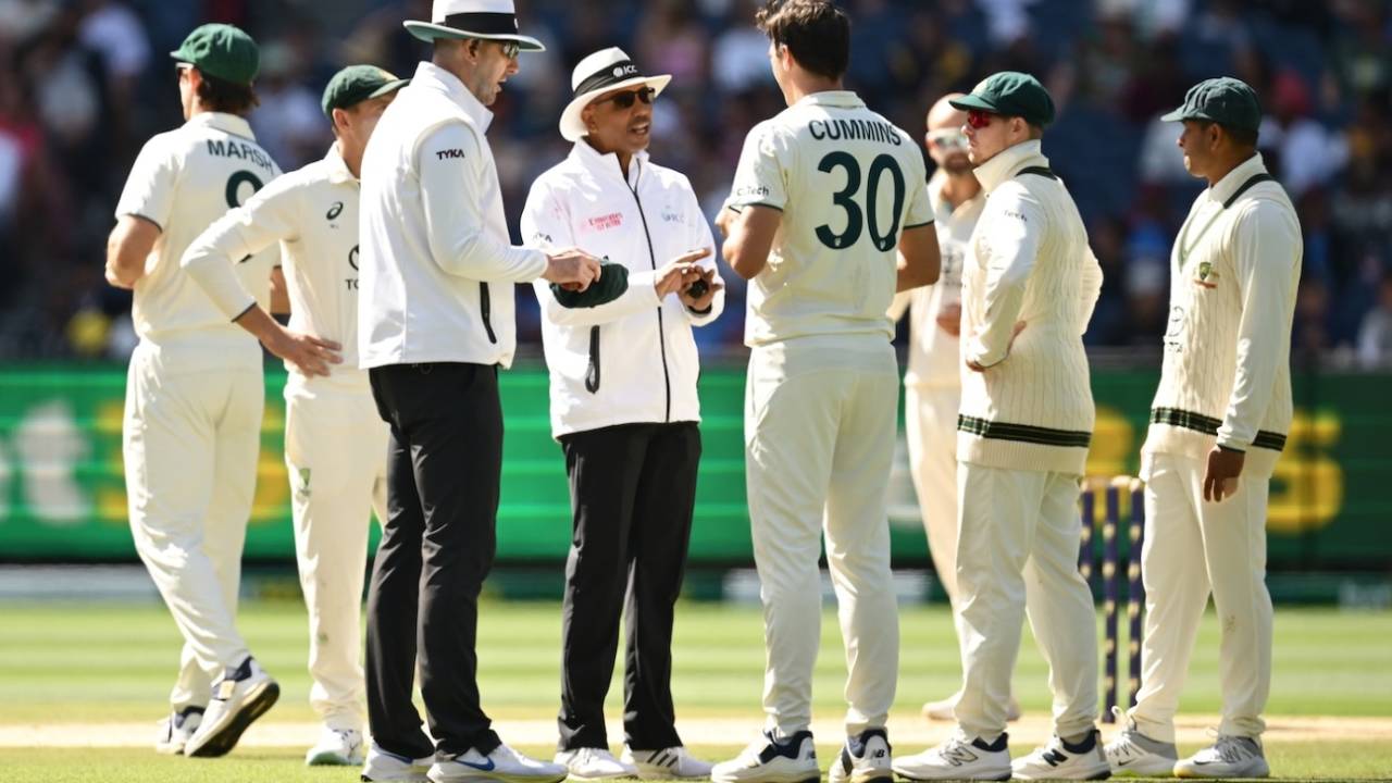 Pat Cummins speaks to umpires Michael Gough and Joel Wilson after a decision went against Australia, Australia vs India, 4th Test, Melbourne, 4th day, December 29, 2024