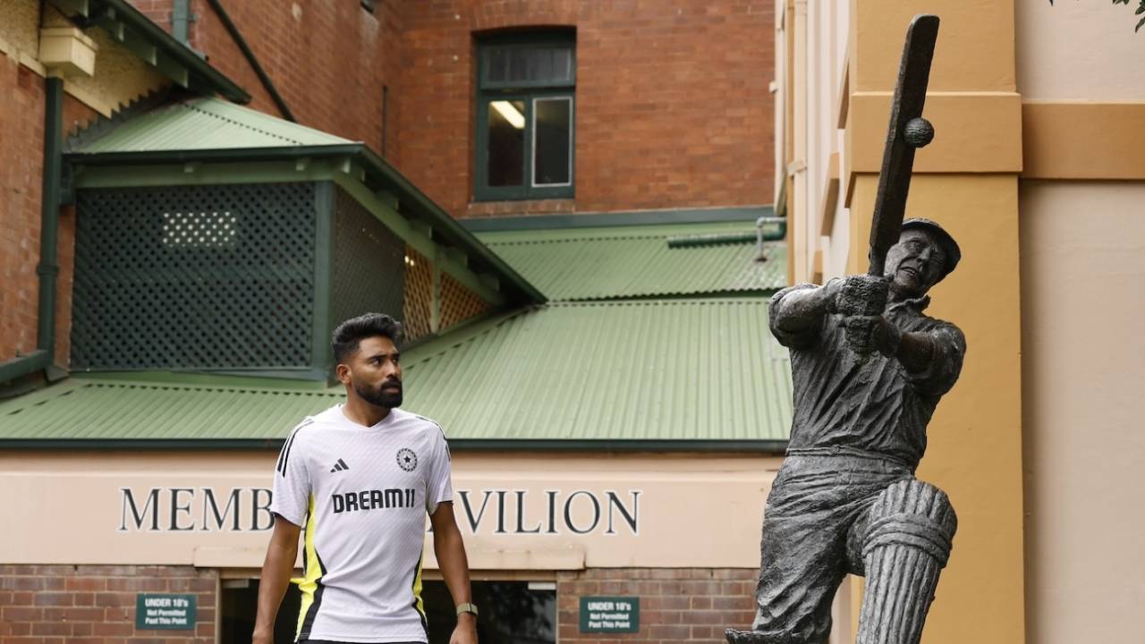 Mohammed Siraj gives the statue of Stan McCabe a quizzical look as he walks past it, Australia vs India, 5th Test, Sydney, January 2, 2025